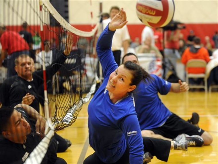 Stacey Pearsall of Air Force tries to stop an Army spike during sit down volleyball at the Olympic Training Center on Tuesday, May 11 in Colorado Springs.